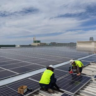 Professional Solar Panel Installation Services Solar technicians installing a large rooftop solar grid.