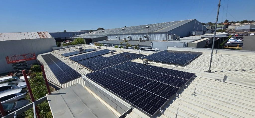 Large-scale commercial solar array installed on an industrial roof in Brisbane